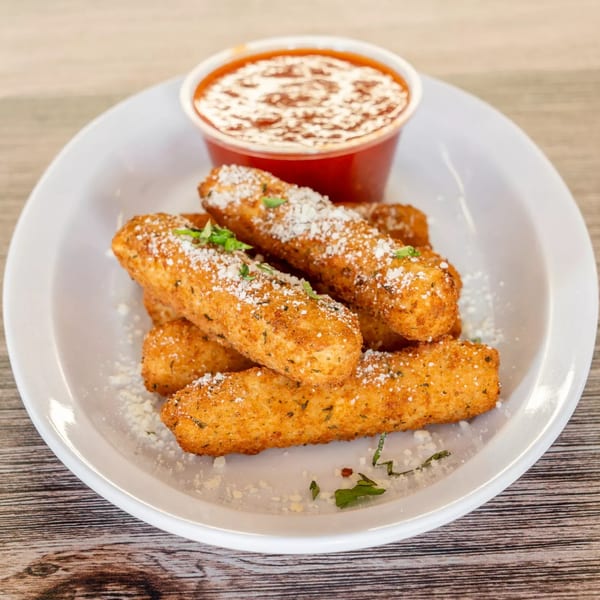 Golden-brown mozzarella sticks, sprinkled with parmesan and herbs, served with a side of marinara sauce.